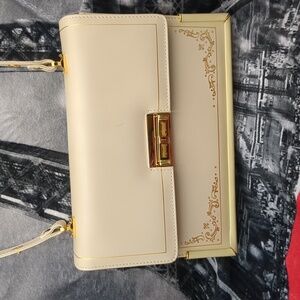 Elegant Cream Shoulder Bag with Gold Accents